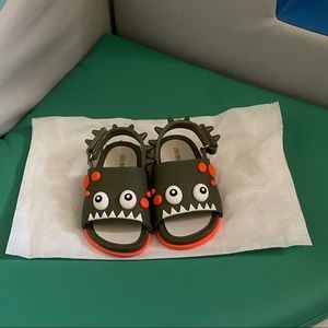 Mini Melissa dinosaur toddler sandals.